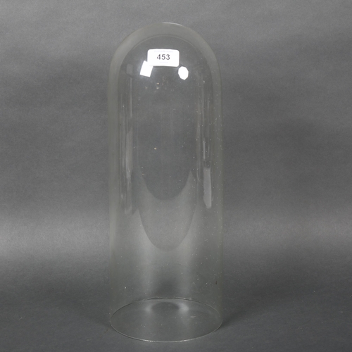 453 - A large glass dome, no associated base, height 40cm.