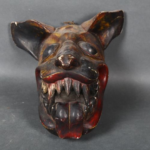 472 - A folk art carved and painted Wolf mask, length 27cm