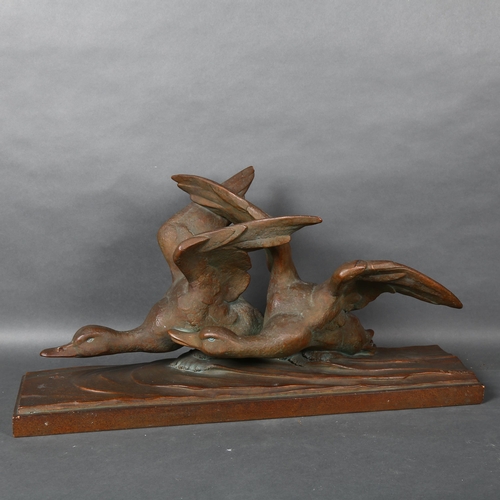 473 - A large patinated bronzed terracotta study of flying geese, signed R Pollin, L72cm