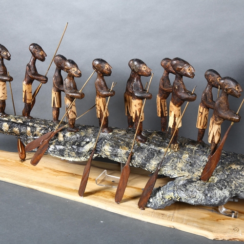 474 - Clive Fredriksson - A mixed media study, figures riding atop a Crocodile, stand, L150cm