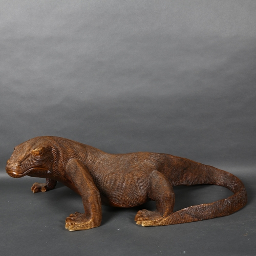 476 - A large carved hardwood study of a Komodo dragon, L75cm