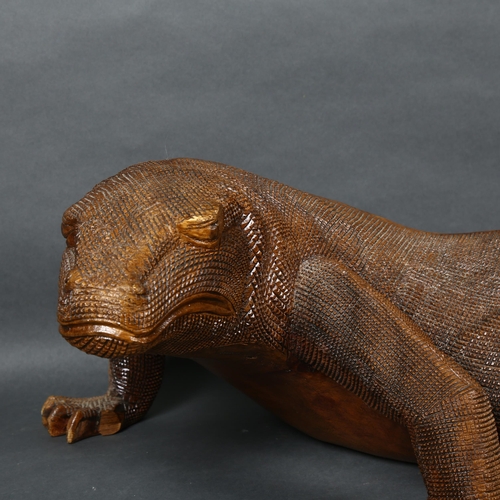 476 - A large carved hardwood study of a Komodo dragon, L75cm