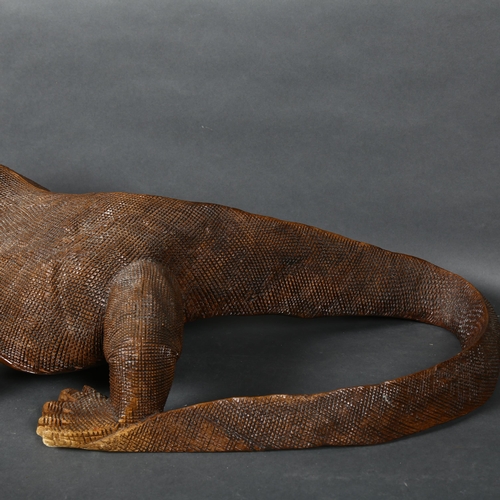 476 - A large carved hardwood study of a Komodo dragon, L75cm