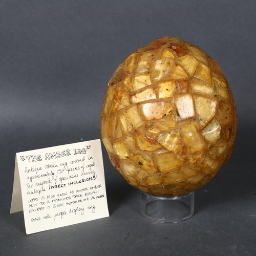 497 - Fossil Curiosity “The Amber Egg”, Ostrich Egg covered in Genuine Copal, an interesting addition to a... 