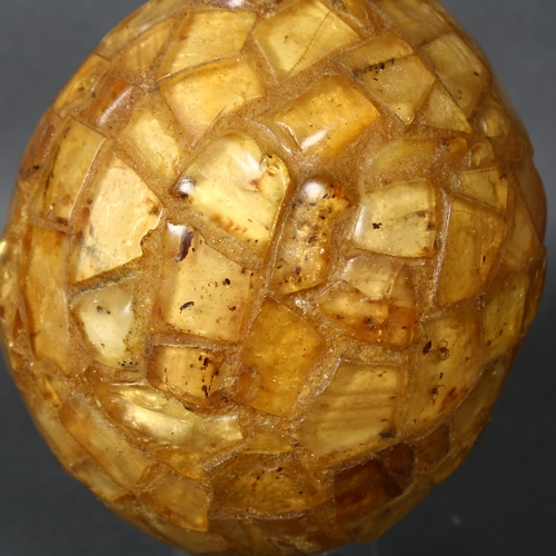 497 - Fossil Curiosity “The Amber Egg”, Ostrich Egg covered in Genuine Copal, an interesting addition to a... 