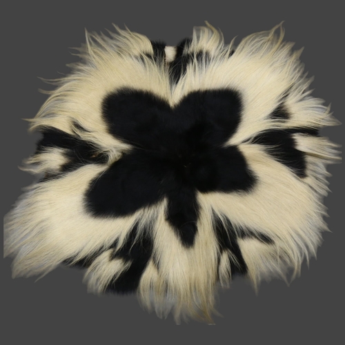 368 - Taxidermy - a Mantled Black and White Colobus Monkey Skin Rug. An early-mid 20th century rug / throw... 