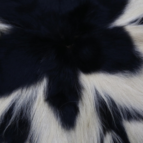 368 - Taxidermy - a Mantled Black and White Colobus Monkey Skin Rug. An early-mid 20th century rug / throw... 