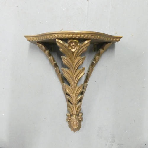 2708 - A modern gilt painted wall bracket. 43x52cm.