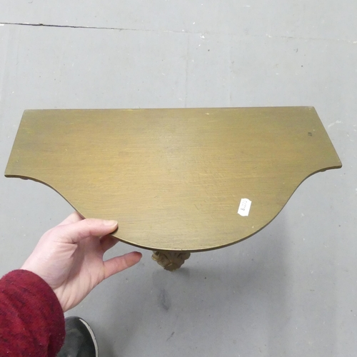 2708 - A modern gilt painted wall bracket. 43x52cm.