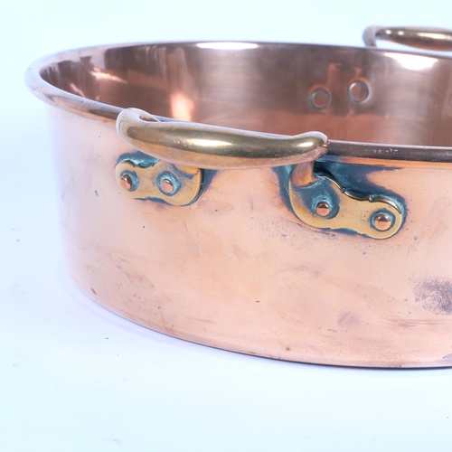 36 - A large Victorian polished copper 2-handled jam pan