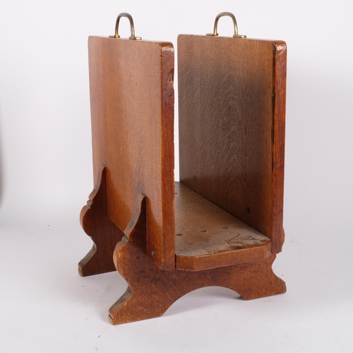 44 - An Art Deco oak and marquetry decorated magazine rack with brass handles, monogramed WHS, H45cm