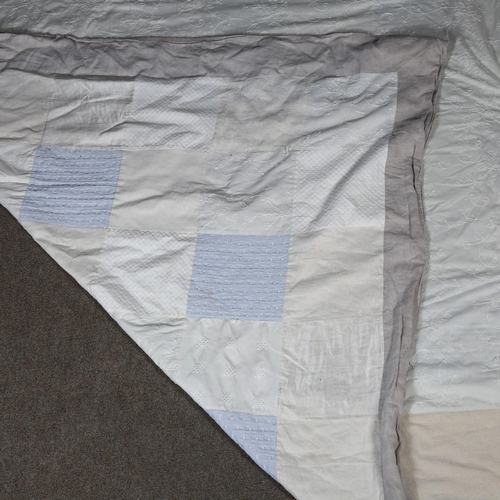 303 - LARA HOLMES, British, a large handmade patchwork bed cover, silk, linen and cotton panels with rever... 