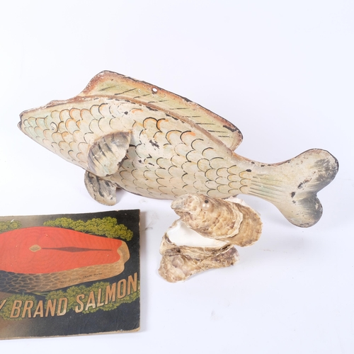 678 - A Vintage painted metal fish sculpture, L46cm, a box made from shells, and a printed card advertisin... 