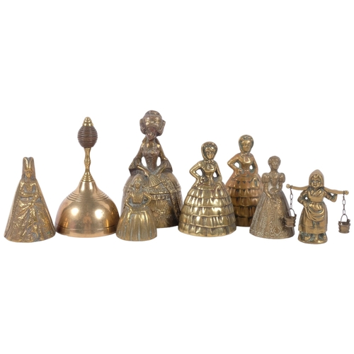 685 - Crinoline lady bells, tallest 15cm, and another brass bell with turned wood handle lacking clapper