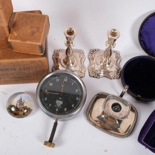 687 - A pair of candlesticks, 11cm, chamber stick, Smiths clock, and empty boxes