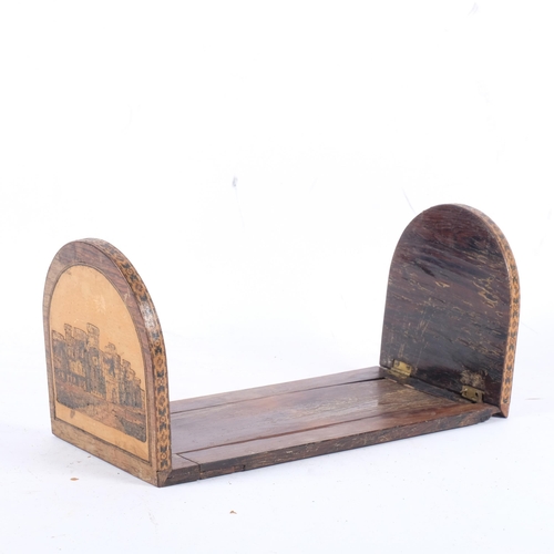 693 - An Antique Tunbridge Ware table-top sliding bookrack, with cube decoration 1 end and castle the othe... 