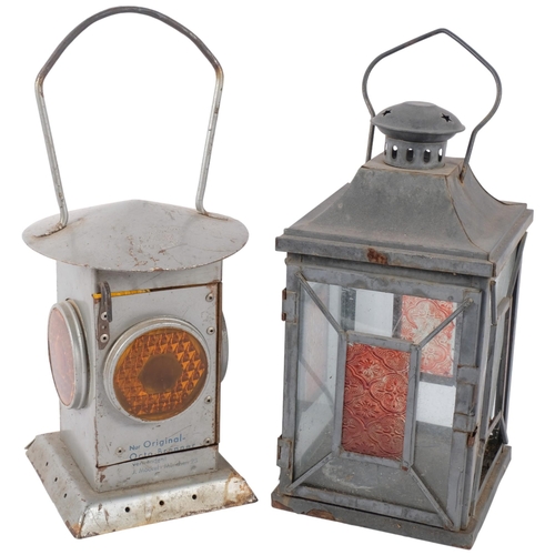 694 - A Ruckstrahler candle lantern with amber lenses, H37cm overall, and a square candle lantern, (2).