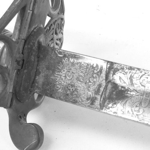 90 - An 1827 pattern Officer's sword, with engraved blade and pierced guard with cipher, blade length 82c... 