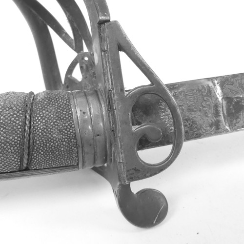 90 - An 1827 pattern Officer's sword, with engraved blade and pierced guard with cipher, blade length 82c... 