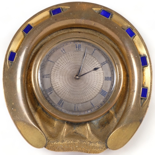 105 - A bronze and blue enamel decorated desk clock, in the form of a horse shoe, with engine turned dial,... 