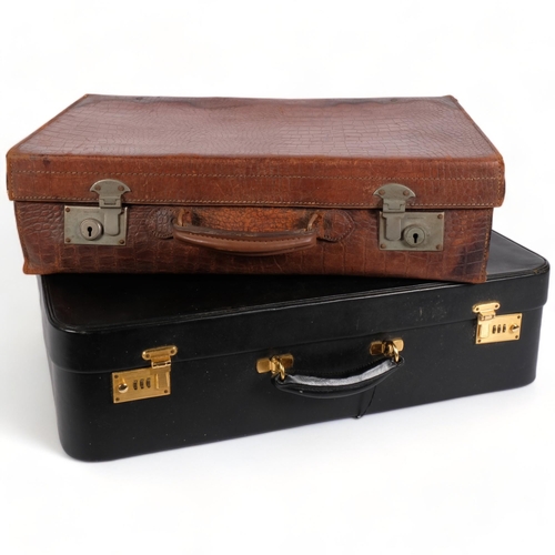 112 - An early 20th century crocodile skin vanity case, with English lever locks, W56cm, and another (2)