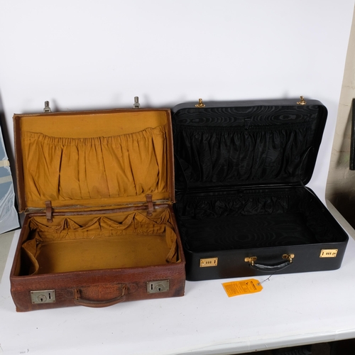 112 - An early 20th century crocodile skin vanity case, with English lever locks, W56cm, and another (2)