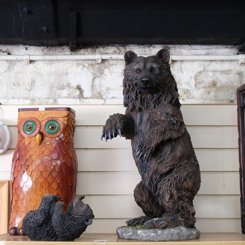 115 - A stained resin study of a brown bear, H76cm, a resin bear table stand (no top), 16cm, and a wicker ... 