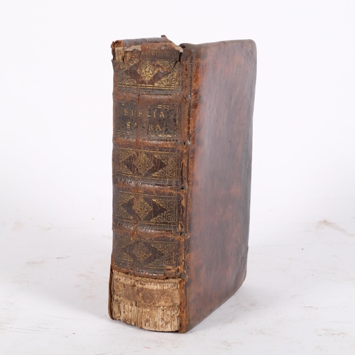 122 - A 18th century leather-bound Bible (Biblia Sacra Vulgat additions Sizti V dated 1716)