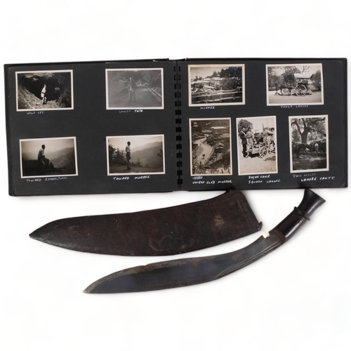 142 - A Malayan kukri knife in leather scabbard, and a photograph album containing photographs from Bombay... 