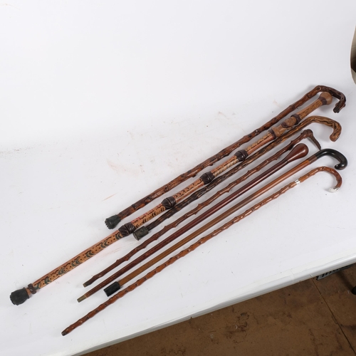 155 - A group of various walking canes and staffs (7)