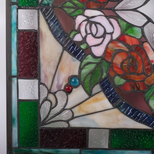 160 - A stained glass and leadlight framed panel, decorated with roses and foliage, 52cm x 52cm