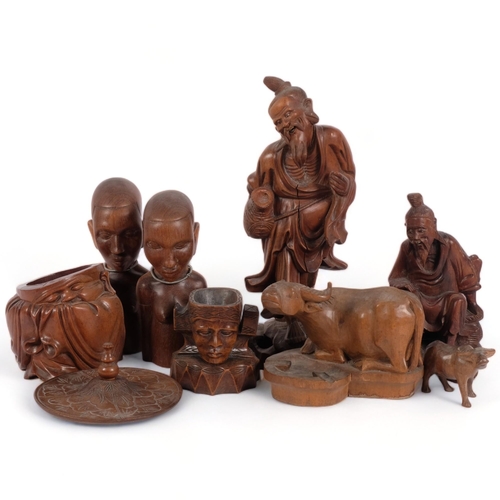 165 - A group of Oriental hardwood carvings, various tourist pieces, including various fish man statue fig... 