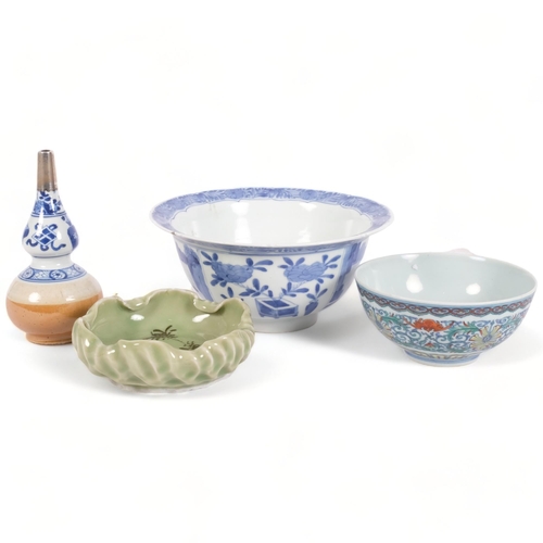 168 - A group of modern Oriental ceramic items, including a blue and white centrepiece bowl, with 6 charac... 