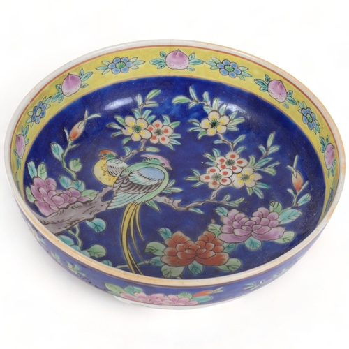 172 - A hand painted Oriental centrepiece bowl, with floral blue margined outer border, and similar floral... 