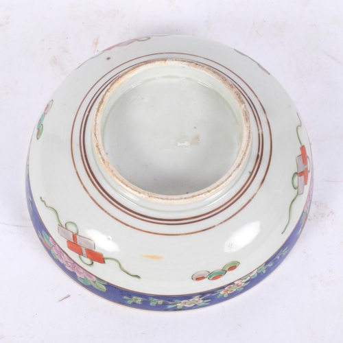 172 - A hand painted Oriental centrepiece bowl, with floral blue margined outer border, and similar floral... 