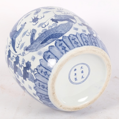 174 - A large blue and white Chinese ginger jar, with transfer printed dragon or mythical creature decorat... 