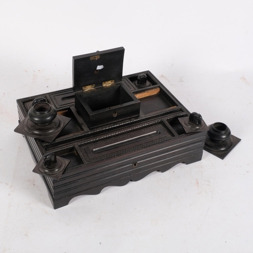 182 - An Anglo-Indian Colonial writer's tidy or desk stand, with fitted lids and carved elephant decoratio... 