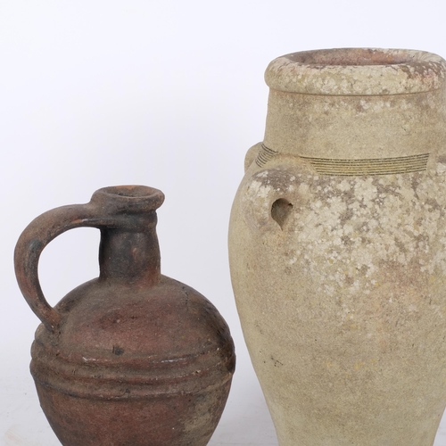 188 - An Ancient pottery jug, and a similar pottery vase with handles, largest height 41cm (2)