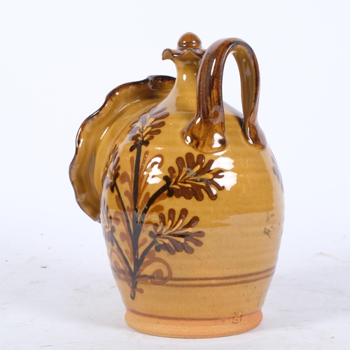 191 - A Studio pottery slipware salt holder, maker's stamp to rear, H23cm