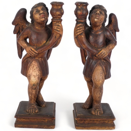 198 - A pair of Antique Gothic style wooden candlestick holders, in the form of angels, angels are holding... 