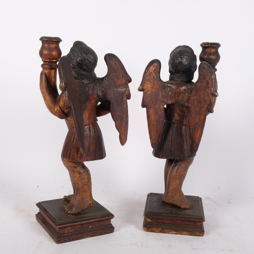 198 - A pair of Antique Gothic style wooden candlestick holders, in the form of angels, angels are holding... 