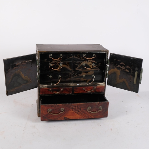 200 - A lacquered mother-of-pearl inlaid Chinese table-top jewellery cabinet, a total of 9 drawers, 29.5cm... 