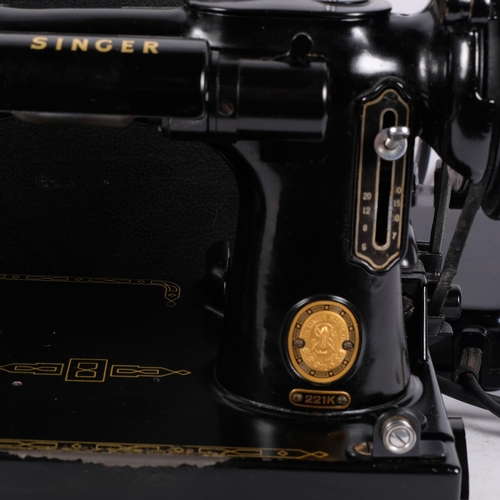 219 - A Vintage Singer Featherweight 221K sewing machine, with associated case and accessories, case 36cm ... 