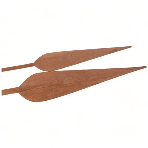 240 - 2 large wooden African paddles, largest length 220cm