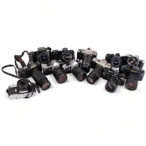 245 - A selection of Vintage cameras and associated lenses, including a Pentax Super A, a Canon T50, a Pen... 