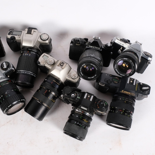 245 - A selection of Vintage cameras and associated lenses, including a Pentax Super A, a Canon T50, a Pen... 