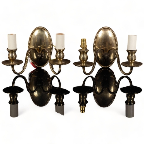 249 - A pair of brass wall sconces with ram's head decoration (2)