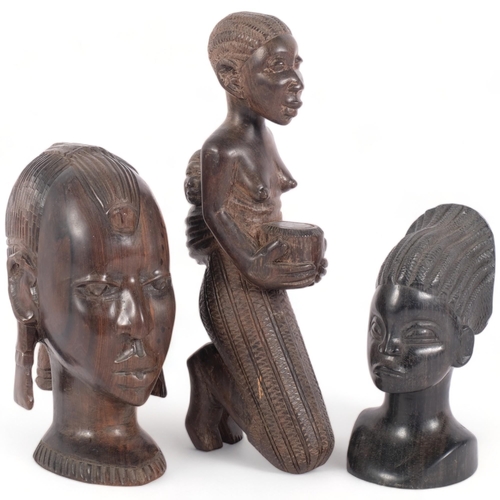 253 - A group of 3 hardwood African Tribal figures, including 2 hardwood busts and a kneeling fertility fi... 