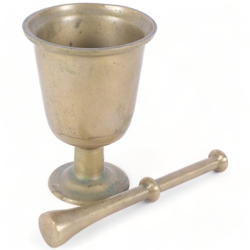 255 - A large solid brass pestle and mortar, H21cm, unmarked