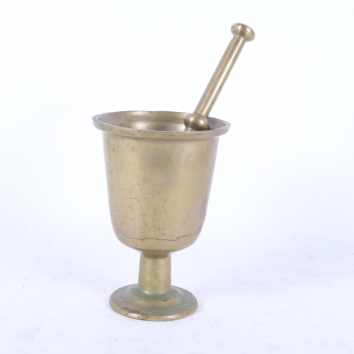 255 - A large solid brass pestle and mortar, H21cm, unmarked